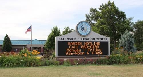 Pictured is a digital sign at Sedgwick County Extension Center that shows the hours for the Garden Hotline.