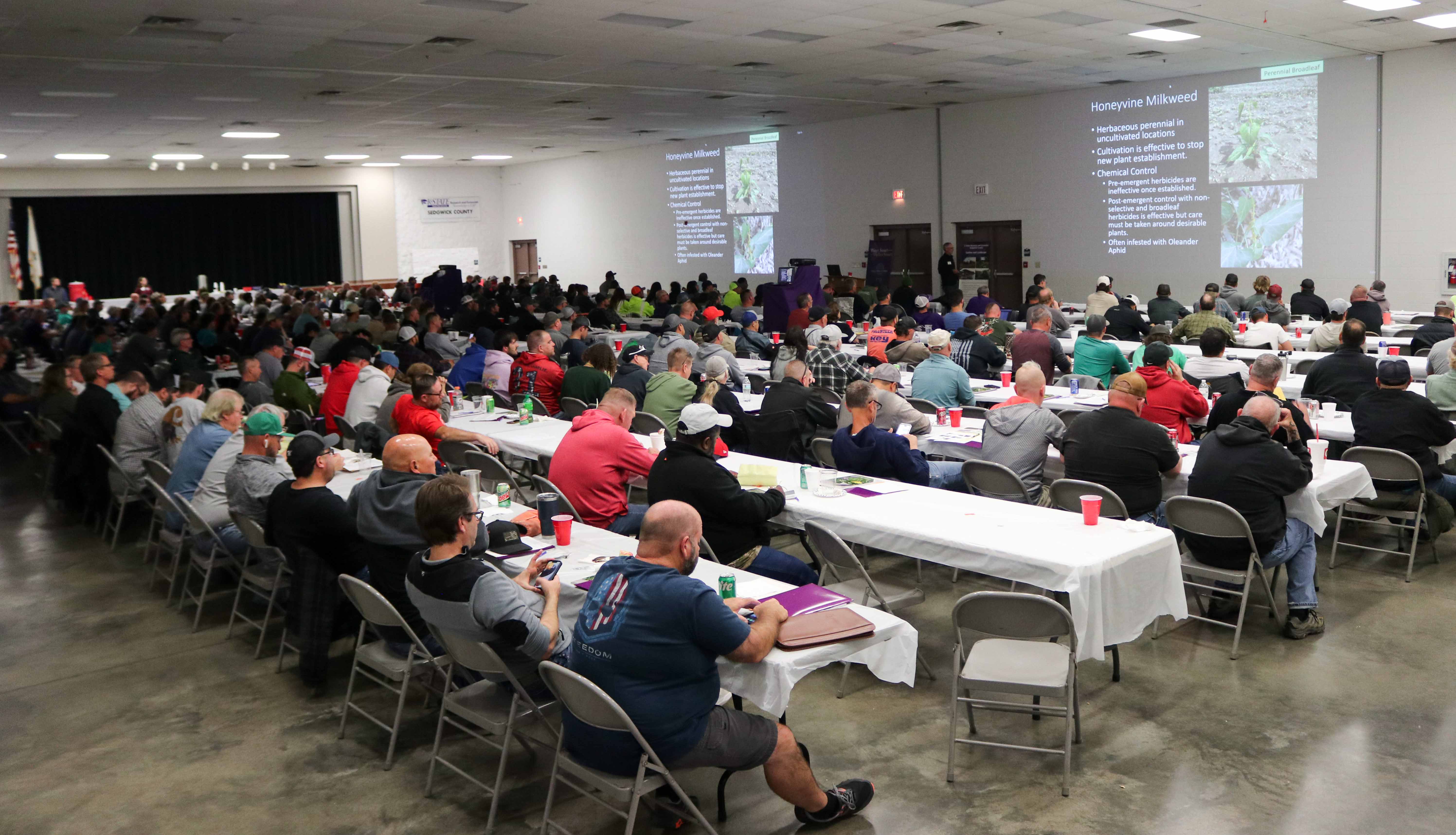 Attendees listening to pesticide workshop presentation