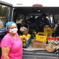 Donna Pearson McClish and Sharon Gaither of Common Ground Producers and Growers, collects produce donations for their food box program. 