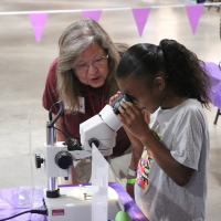 Master Gardener volunteer teaches youth about the vital role trees play