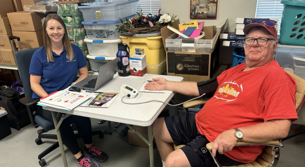 A medical professional checking blood pressure
